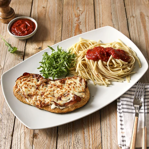 Escalope de veau panée avec jambon speck, crème, mozzarella gratinée. Suggestion de garniture : linguines natures ou avec sauce au choix ( sauce tomate, pesto vert ou persillade citronnée) Escalope de veau panée avec jambon speck, crème, mozzarella gratinée. Suggestion de garniture : linguines natures ou avec sauce au choix ( sauce tomate, pesto vert ou persillade citronnée)